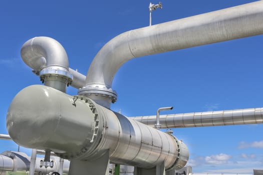 Steel pipe line with blue sky in sunny day