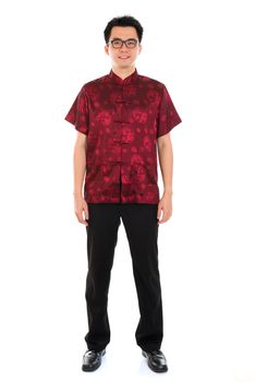 Full body portrait Asian man with Chinese traditional cheongsam or tang suit. Chinese New Year concept. Male model isolated on white background.