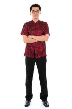 Full body portrait Asian male with Chinese traditional cheongsam or tang suit. Chinese New Year concept. Male model isolated on white background.