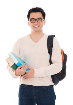 Asian adult student in casual wear with school bag carrying text books standing isolated on white background. Asian male model.