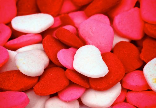Background of Multi Colored Cake Sprinkles Hearts closeup