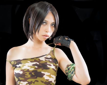 Asian female in army clothing on isolated background