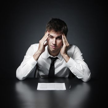 Young businessman has the headache