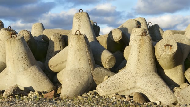 Breakwater protecting the coastline in the port of Ventspils on                       