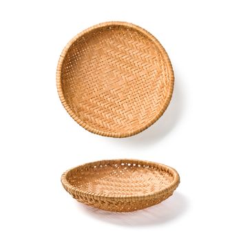 two wicker plates isolated on white background