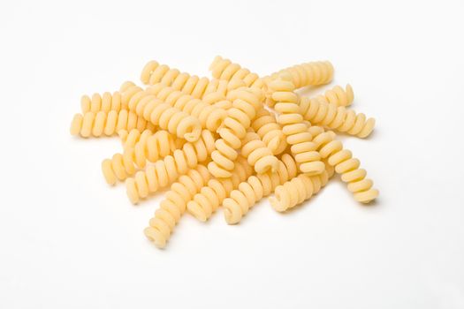 heap of pasta on white background