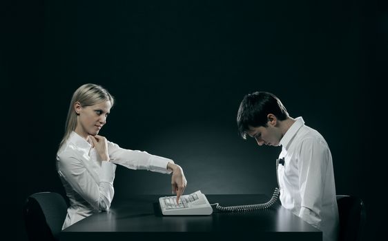 Power of women. Young woman controls her husband with a keyboard