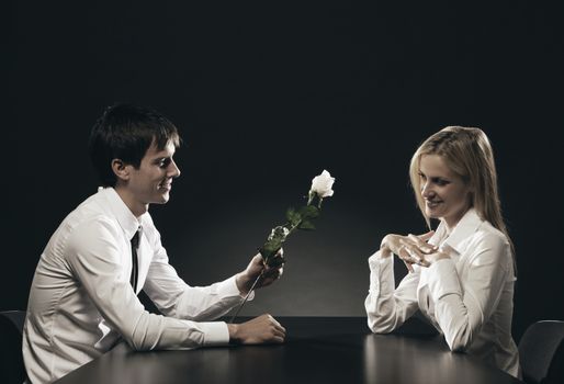 Man in love gives a rose to his girlfriend