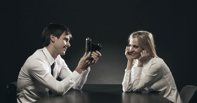 Young Man Photographing Girlfriend