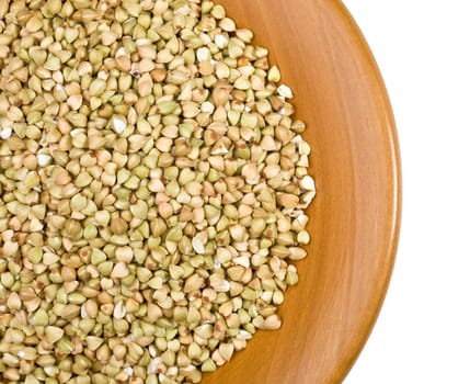 green buckwheat close up in a wooden bowl