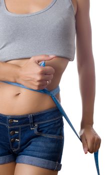 Keeping a diet and fitness rutine - Measuring tape around a waist, woman.