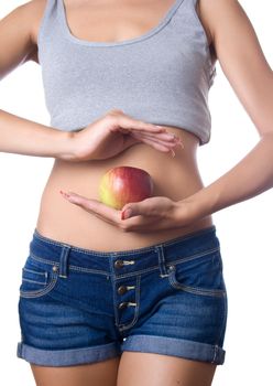 Perfect Slim Woman Body and apple on white background. Diet Concept