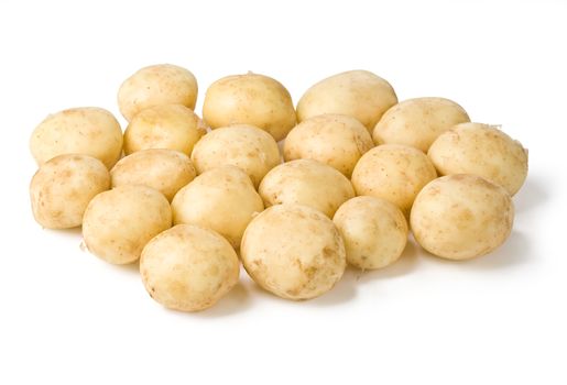 bunch of potatoes on white background close up with clipping path