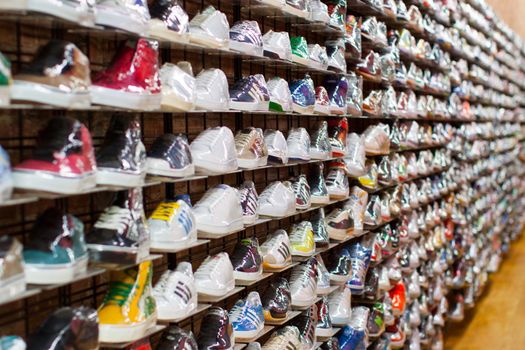 Shelf full of shoes in a shoe store.