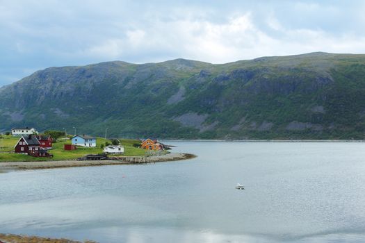 Norwegian village over fjord background, Scandinavia, Europe