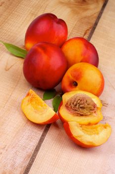 Perfect Ripe Peaches Full Body and Slices on Wooden background