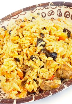 Traditional Asian Pilau with Meat, Barberry and Carrot closeup on Variegated Plate