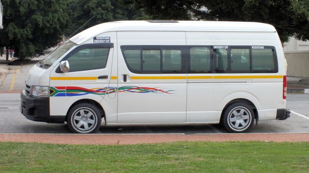 Like many African cities, cities in South Africa have a chaotic informal public transport systems in the form of minibus "taxis". They are small-scale bus services operating with neither timetables nor formal stops. To try to improve safety the government has provided a fleet of new minibuses like the one in the photo.