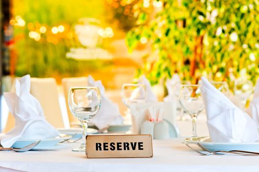 beautifully laid for supper table with a sign reserved