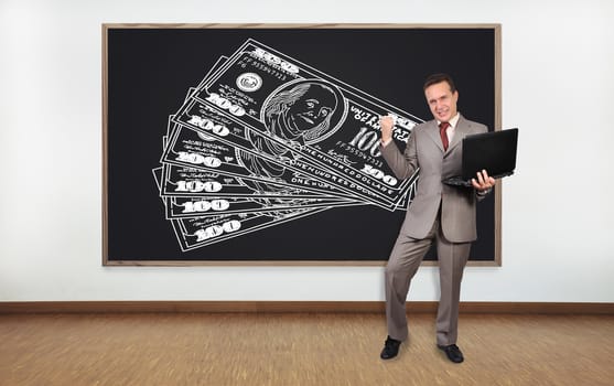 happiness businessman and blackboard with dollars on wall