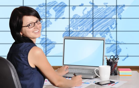 woman with notebook sitting in office