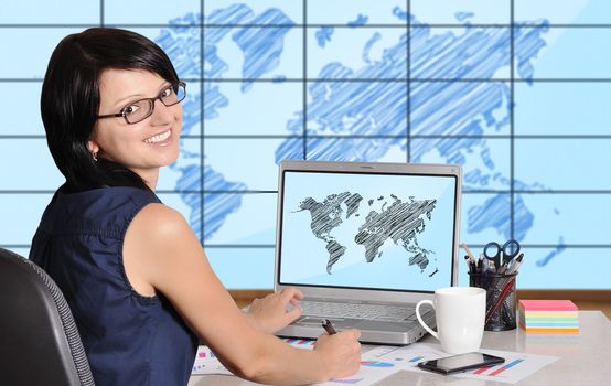 woman with laptop sitting in office