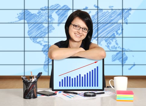 woman with note pad sitting in office