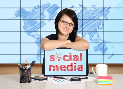 woman with note pad sitting in office, social media concept