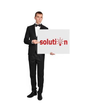 businessman in tuxedo holding poster with solution