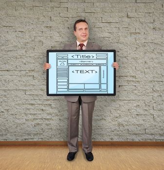 businessman in room holding plasma with template web page