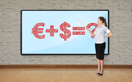businesswoman in office pointing at business formula on plasma