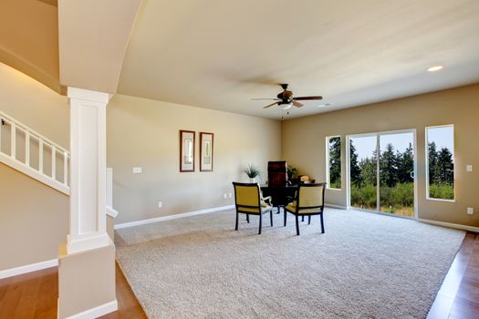 New home kitchen interior and large empty living room.