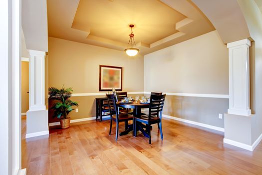 New home dining room interior with hardwood floors and table.