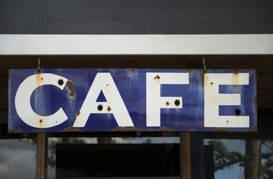 old rusty cafe sign