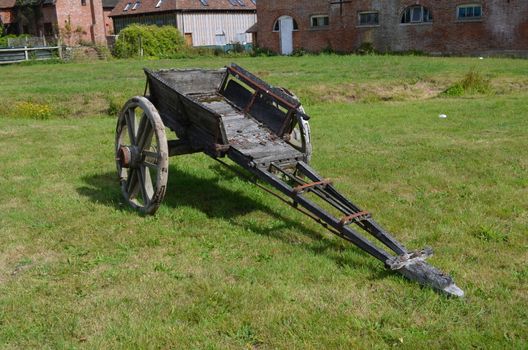 Old wooden horse cart left adbandoned in a farmers field.