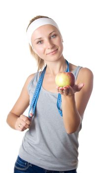 Portrait of a woman with an apple and a measuring tape isolated on a white background