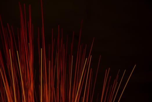 abstract background of red sticks at night