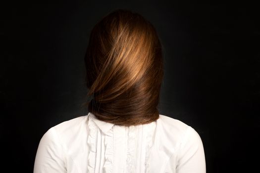 ��onceptual photo of young woman with very long hair which covers her face.  