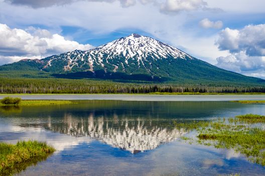 View of Mount Bachelor in Oregon with a reflection in a lake