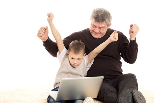 Grandfather and Grandson playing on a white background