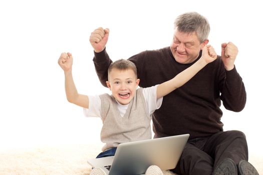 Grandfather and Grandson playing on a white background
