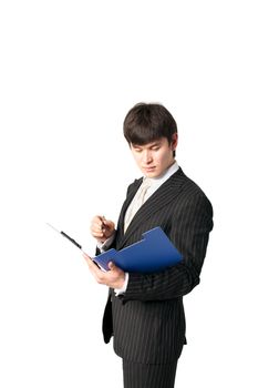 Asian businessman writing in a folder