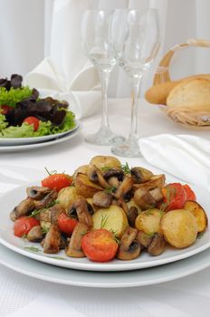 Baked mushrooms with tomatoes and potatoes 