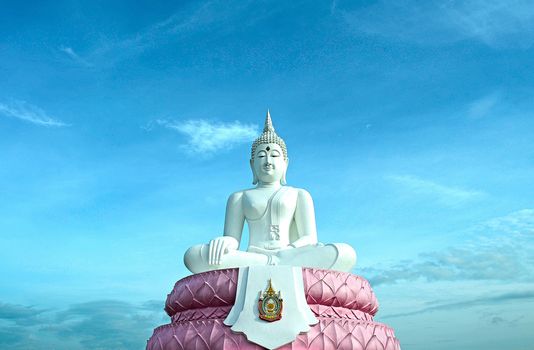 The White Seated Buddha Image of Subduing Mara Attitude with Blue Sky