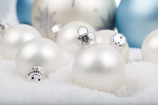 white christmas balls on snow