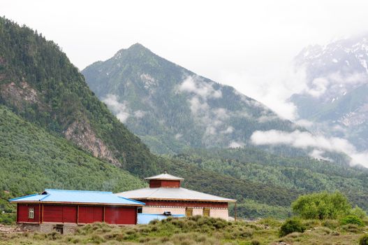 Landscape of mountains and Tibetan houses in Tibet in the summer