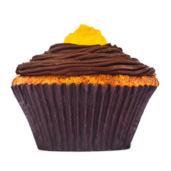 A gorgeous and delicious chocolate and carrot cupcake isolated on a white background.