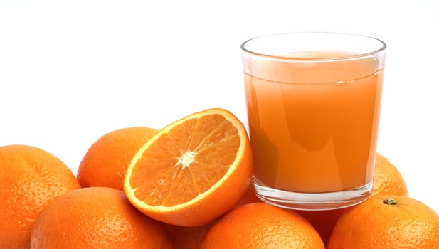 Orane juice and oranges on white background