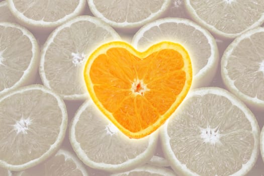 Orange cross section shaped like heart on slice background