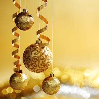 golden christmas balls on bokeh background